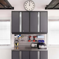 Pegboard Workstation With Grey Cabinets Clock Above And Tools Neatly Arranged On A Stainless Counter