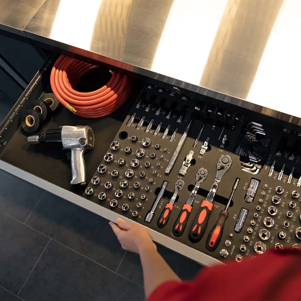 Person Opens A Stainless Top Drawer Organized With Sockets Ratchets Air Tool And An Orange Coil Hose
