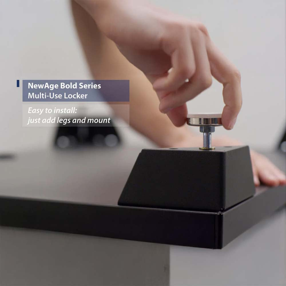 Person’s Hand Attaching An Adjustable Leveling Foot To The Base Of A Black Cabinet Unit During Assembly