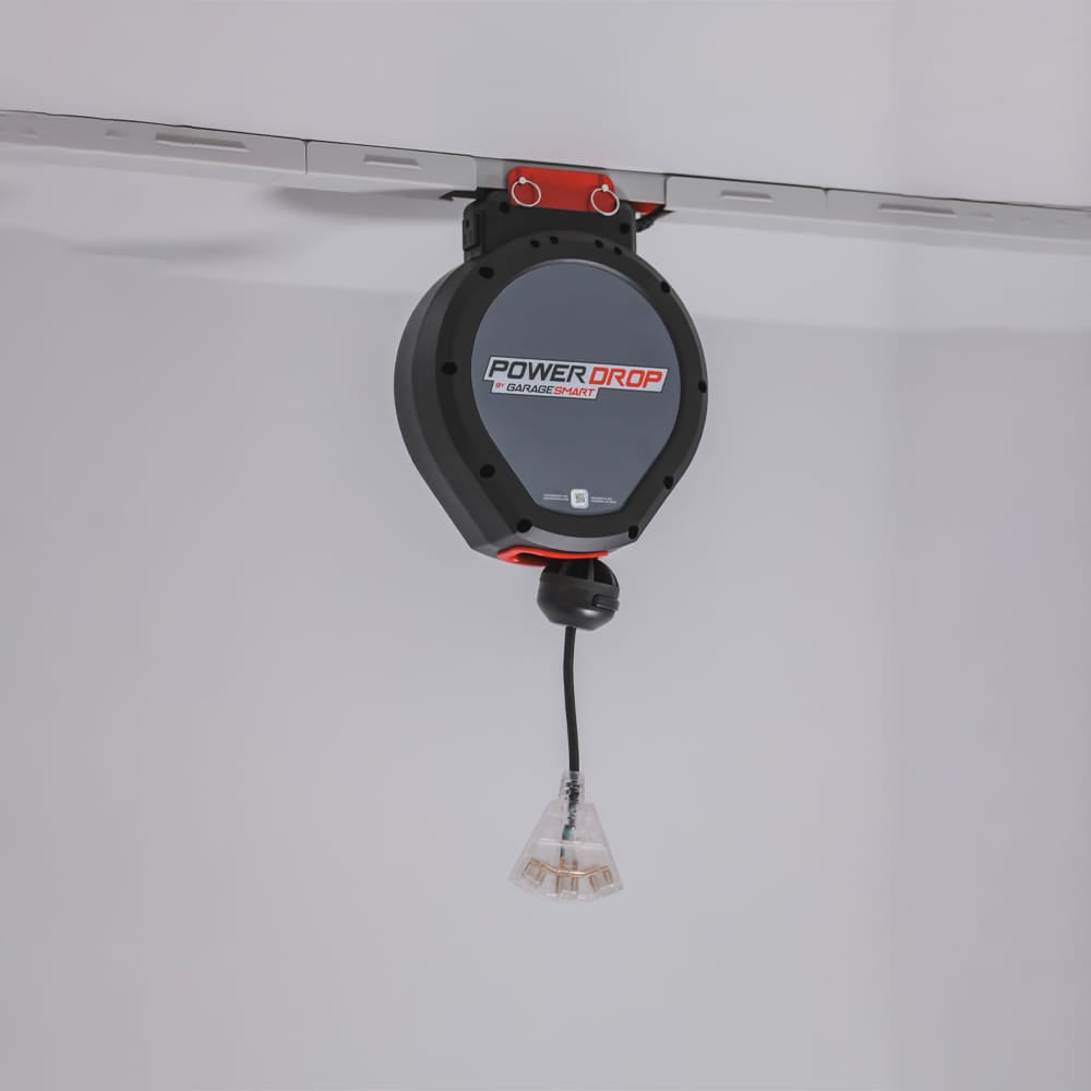 Power Drop Device By Garage Smart Mounted On A Ceiling Track Featuring A Retractable Power Cord With A Plug
