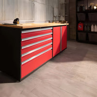 Red Garage Cabinet With Multiple Drawers And Wooden Worktop In Organized Workspace