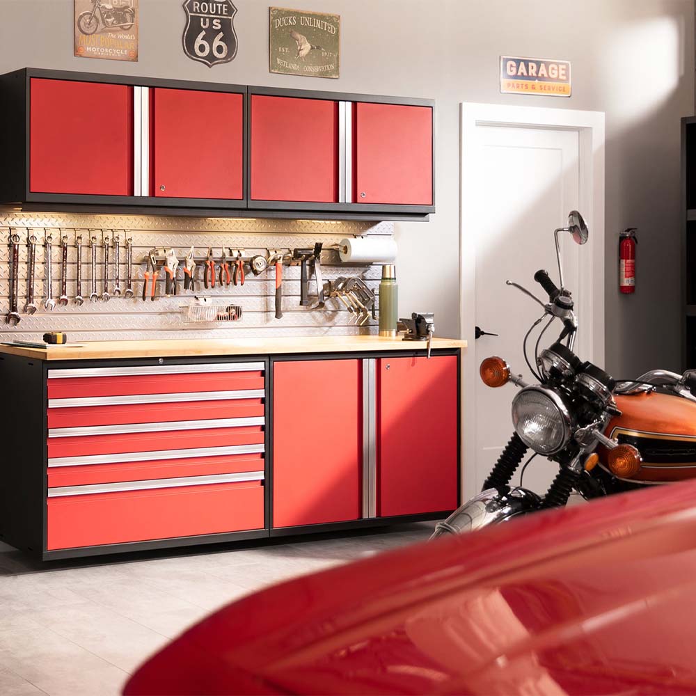 Red_Garage_Workstation_With_Red_Tool_Cabinets_Pegboard_Of_Hanging_Tools_Wall_Signs_And_A_Motorcycle_Parked_Beside_A_Red_Car_Hood