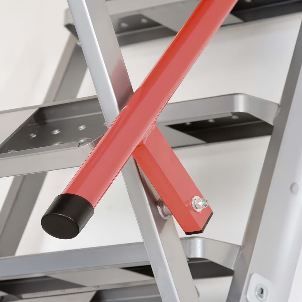 Red Metal Safety Handrail Securely Bolted To A Silver Aluminum Attic Ladder