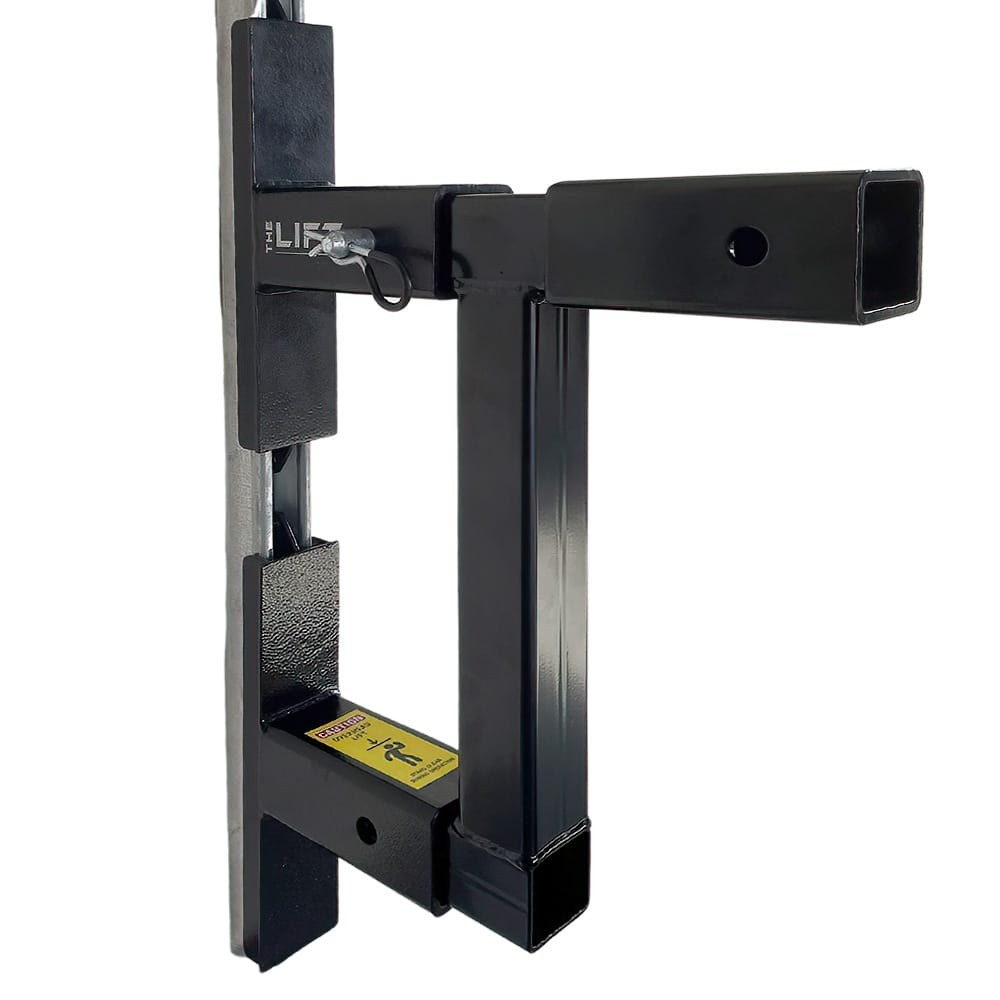 Robust Black Double Hitch Connector With A Locking Mechanism Mounted On A Vertical Grey Post