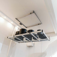 Series Of Black Cylindrical Containers Arranged On A Suspended Metallic Mesh Platform Of AuxxLift Garage Ceiling Storage