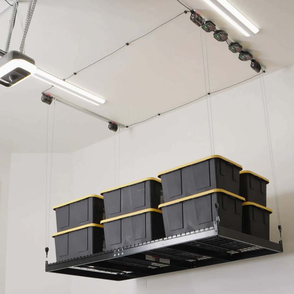 Smarter Home Overhead Hoist System Suspended From The Ceiling Loaded With Several Large Storage Bins