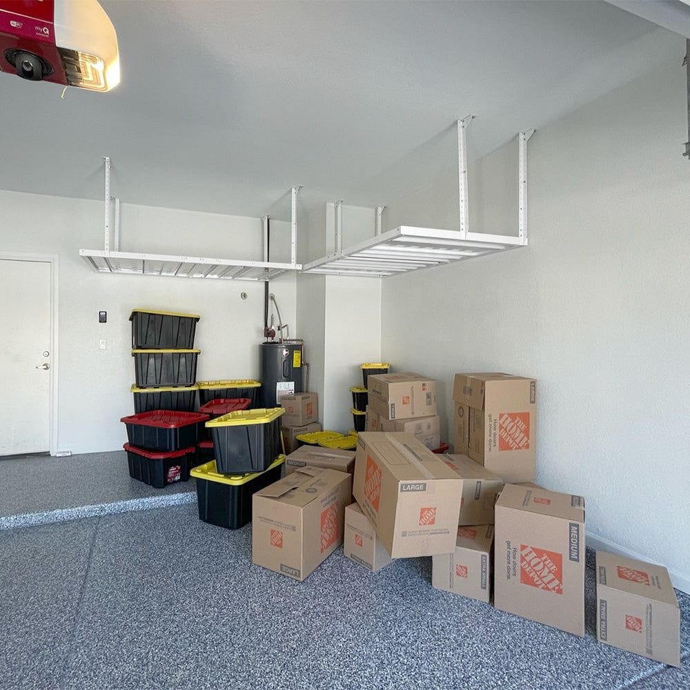 Spacious Garage With Two EZ Storage Garage Overhead Rack installed On The Ceiling And Multiple Boxes And Storage Bins Scattered Below