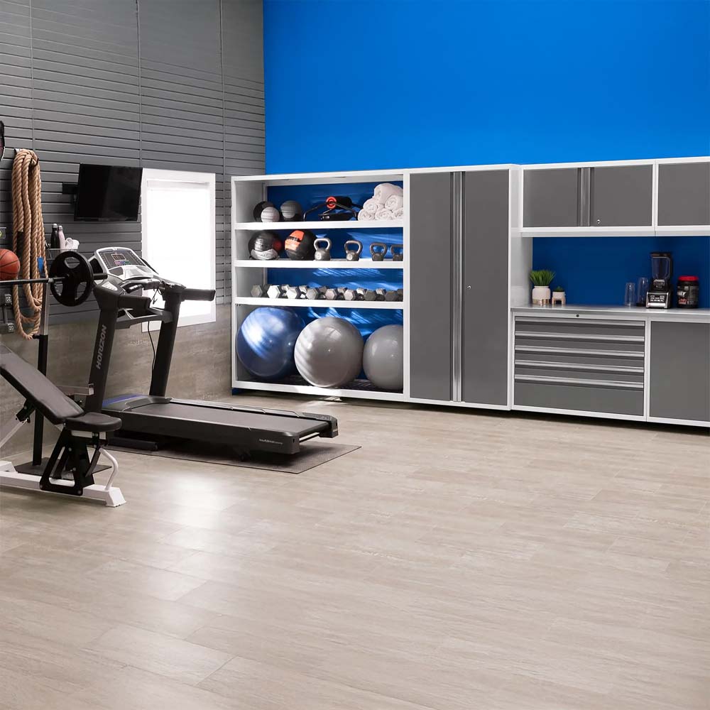 Spacious Home Gym With Treadmill And Bench Facing A Wall Of Modern Storage Cabinets
