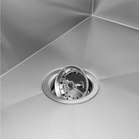 Stainless Steel Sink With A Modern Strainer Basket In The Drain Hole