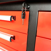 Tool Cabinet Shows The Central Lock With Keys And White Drawer Handles