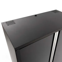 Top View Of A Black Metal Storage Cabinet With Ventilation Panels And A Cable Grommet