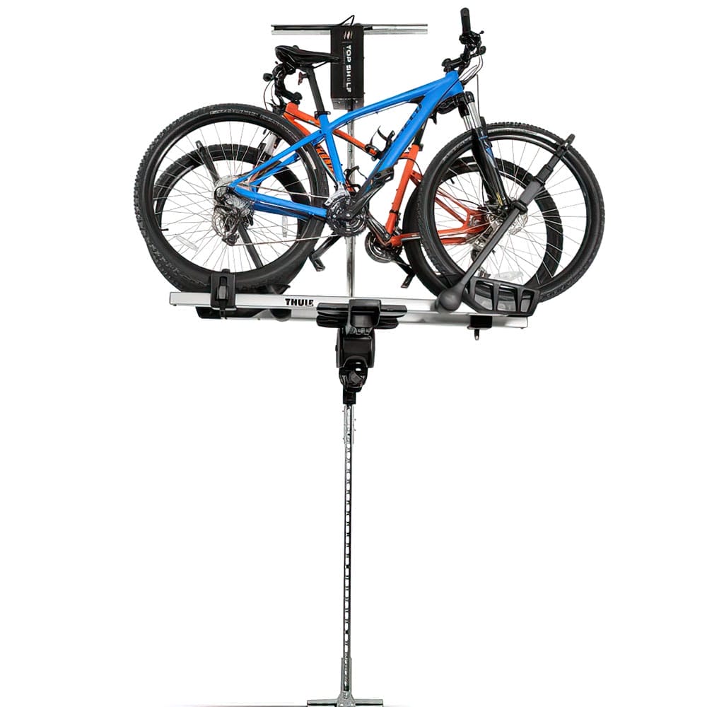 Two Bicycles Securely Mounted On Top Shelf Storage The Lift 200 Featuring A Central Control Unit And A Vertical Support