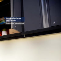 Under Cabinet View Of NewAge Pro Series Wall Cabinets Showing Mountable Light Valance And Stored Items On The Lower Shelf
