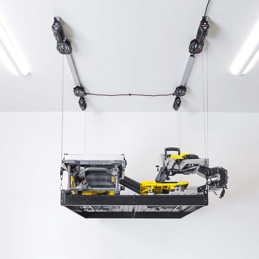 Variety Of Power Tools Are Organized On A Suspended Grid Like Metal Shelf Attached To A Ceiling By Garage Platform Lift By SmarterHome