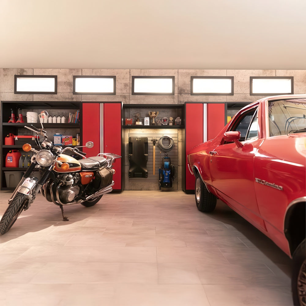 Vintage Motorcycle And Red Classic Car Parked In Garage With Red Cabinets And Illuminated Storage Wall