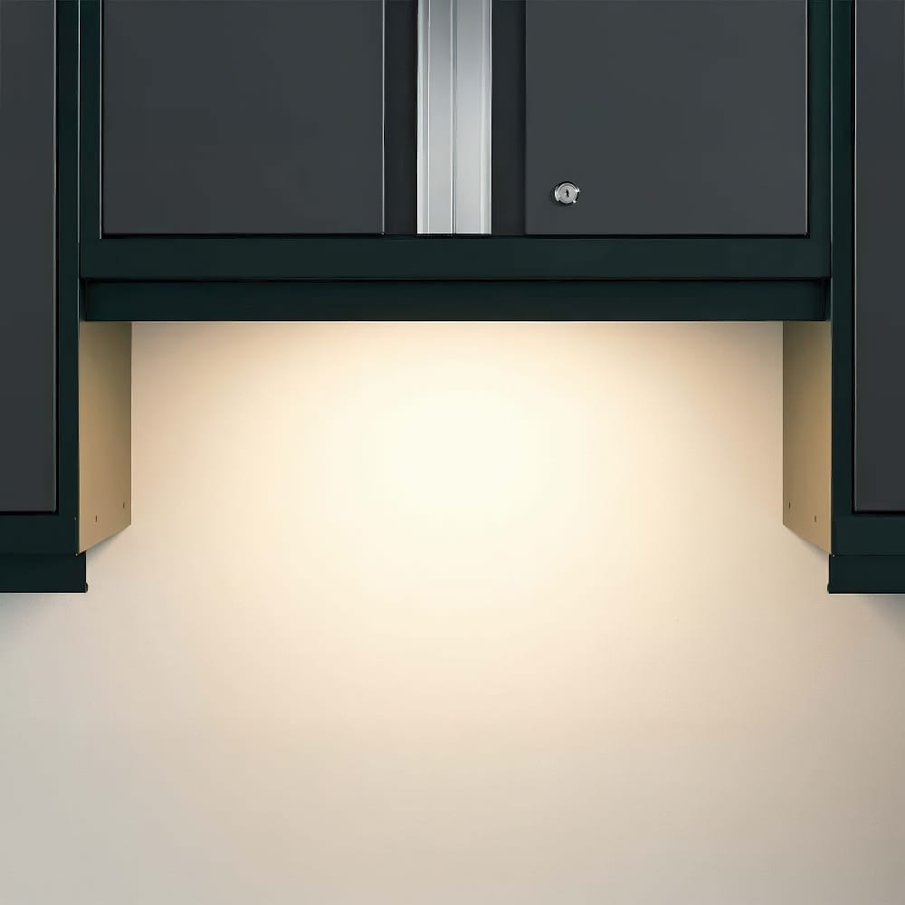Well-Lit Workspace Beneath A Set Of Sleek Wall-Mounted Black Garage Cabinets