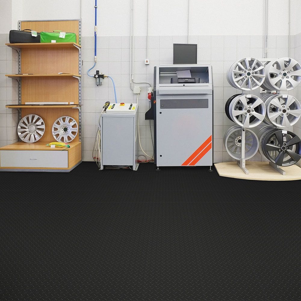 Well-Organized Garage With A Machine Shelves, With Car Parts And Accessories, And Perfection Tile PVC Floor Tiles Covering The Floor