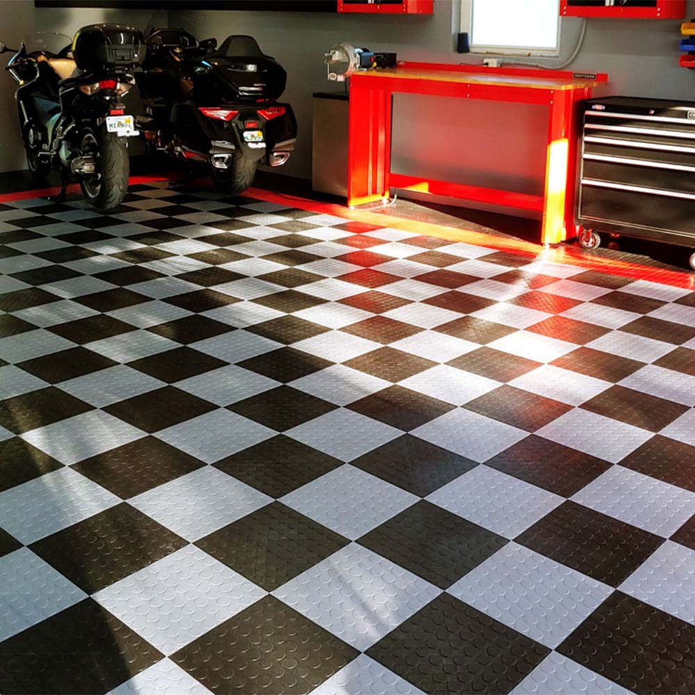 Well Organized Garage With RaceDeck Circle Trac Flooring Two Motorcycles Parked In The Background And A Red Tool Chest And Workbench