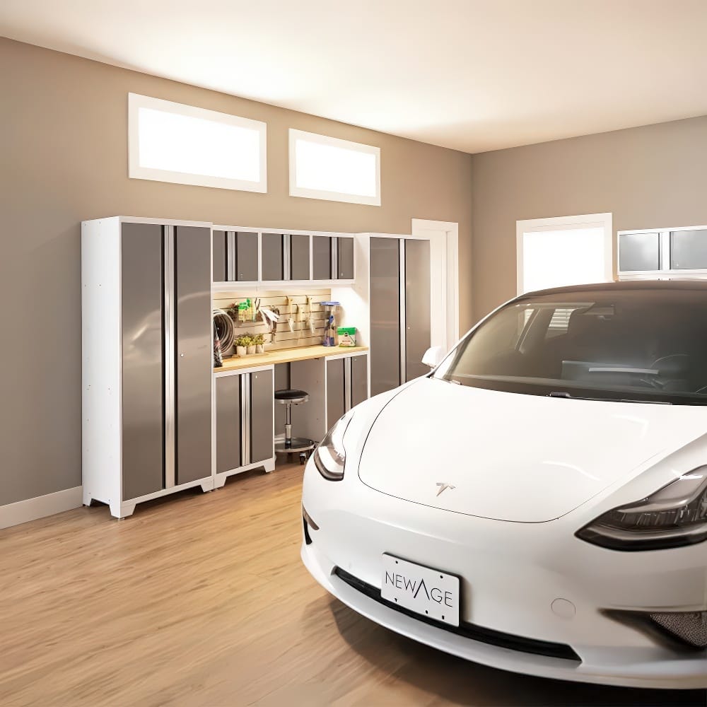 White Car Is Parked In A Well-Organized Garage Featuring Gray And White Modular Cabinets  A Wooden Workbench  And A Pegboard Tool