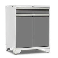 White Framed Garage Cabinet With Grey Top Drawers And Matching Double Doors Stands On Adjustable Leveling Feet