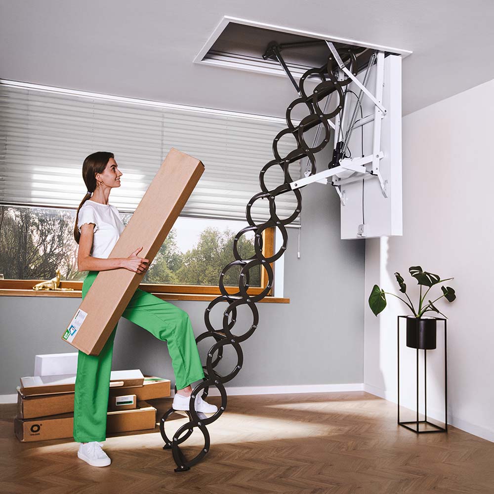 Woman With Long Package Steps Onto Retractable Attic Ladder