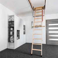 Wood Folding Attic Ladder Fully Extended From A Ceiling Hatch