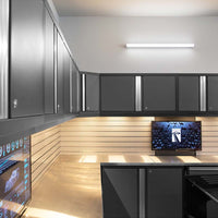 Workspace Featuring Garage Cabinet Set Pro 3.0 9 Piece With Utility Cart And A Light Wood Paneled Lower Wall With Integrated Lighting